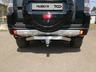 Фаркоп ТСС оцинкованный под американский квадрат для Mitsubishi Pajero IV 2006-2022 с накладкой из нержавеющей стали. Артикул TCU00085